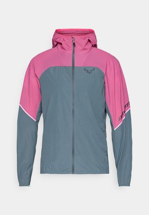 Veste légère avec une partie supérieure rose et une partie inférieure grise. Elle dispose d'une fermeture éclair à l'avant, d'une capuche et d'un détail de marque noir sur la manche. Tissu respirant.