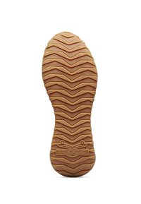 Suela de zapato de goma con un patrón texturizado en zigzag; color marrón claro; presenta una impresión de logo que dice "VOILE BLANCHE" cerca del borde inferior.
