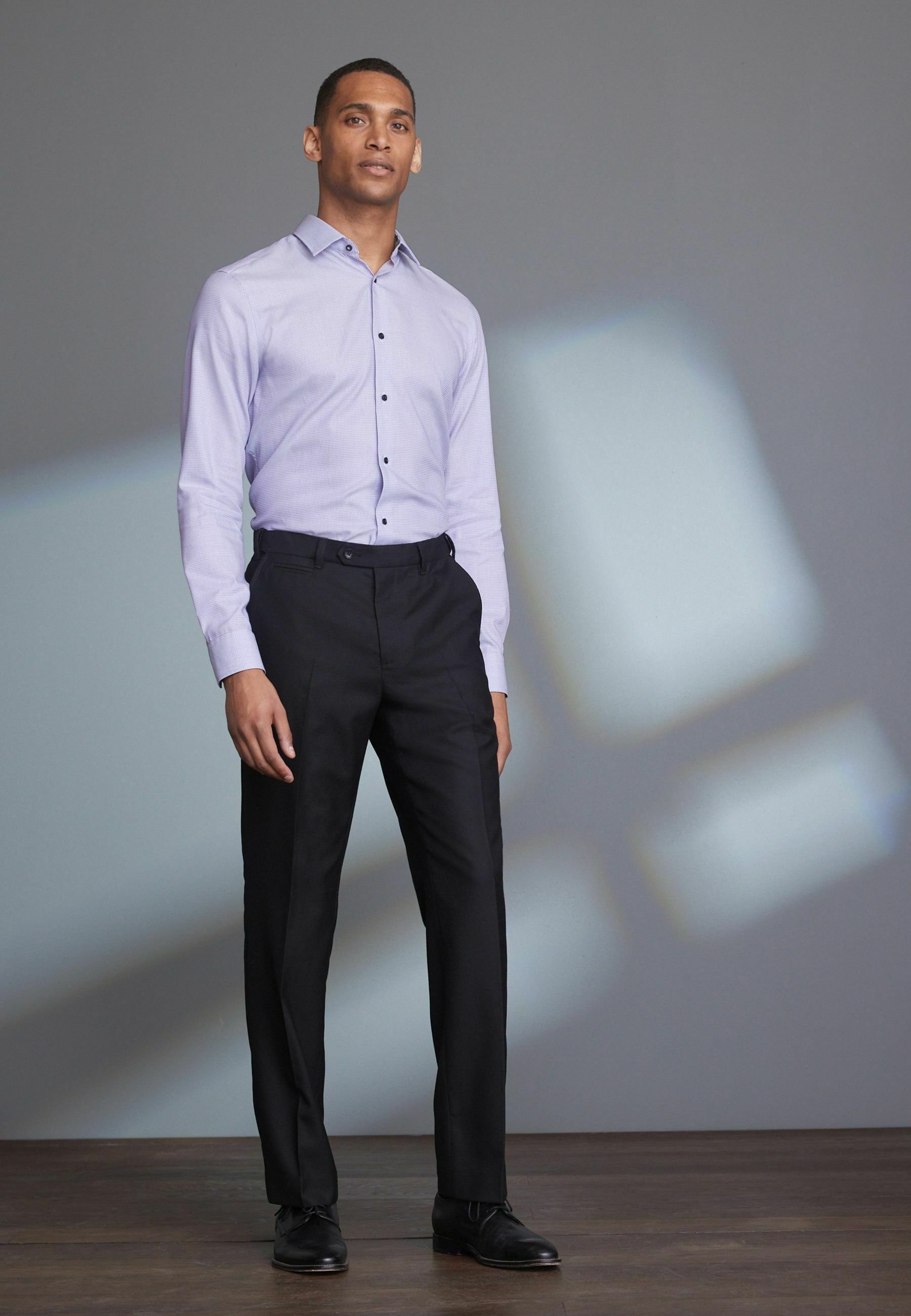 MOTION FLEX - Suit trousers - black 