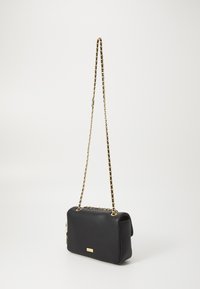 Black textured leather handbag with a gold chain strap, rectangular shape, and a small hardware logo on the front.