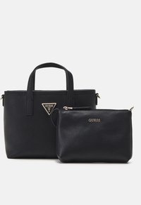 Ensemble de sacs à main en cuir noir, comprenant un grand sac fourre-tout avec des poignées courtes et une petite pochette. Les deux présentent des accents dorés et des détails de marque.