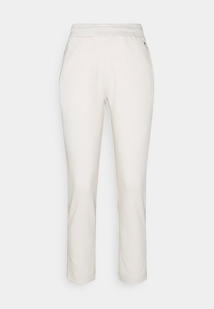 Helle beige Hose aus einem weichen, strukturierten Stoff. Verfügt über einen elastischen Bund und ein gerades Bein Design. Keine sichtbaren Muster oder Akzente.