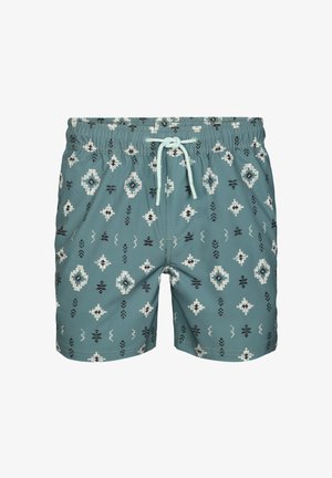 Blauwgroene zwembroek met witte en zwarte geometrische patronen en een lichtblauw trekkoord in de elastische tailleband.
