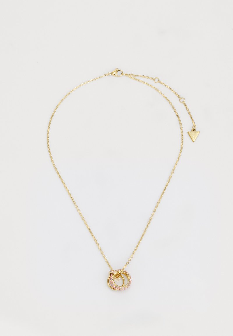 Collier en chaîne en or avec des pendentifs circulaires entrelacés, dont l'un est orné de cristaux roses. Fermeture ajustable avec un détail en forme de triangle.
