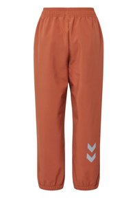 Oranje sportbroeken met een elastische tailleband en taps toelopende boorden. Voorzien van reflecterende chevronaccenten in het grijs op het onderbeen.