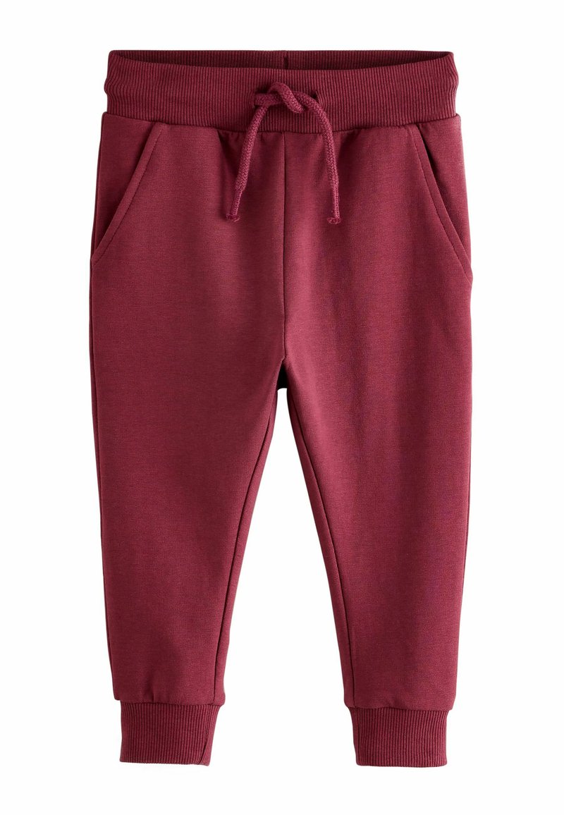 Burgundy joggerbyxor gjorda av mjukt tyg, med elastisk midja, dragsko och sidofickor. Ribbad mudd vid anklarna.