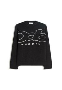 Black sweater featuring a white graphic logo "supply" across the front. Ribbed cuffs and hem, round neckline, standard fit. Soft texture.