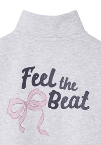 Grey cotton sweatshirt with a high collar, featuring the text "Feel the Beat" in black and a pink bow graphic. Soft texture.