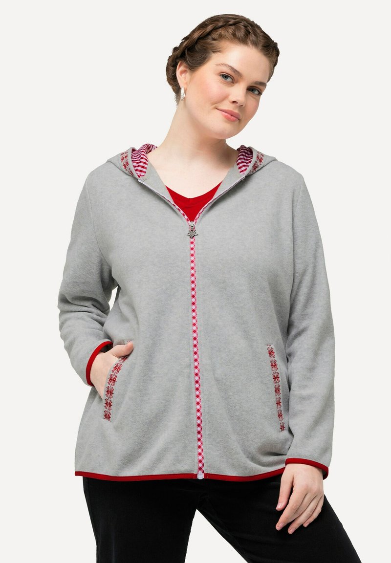 Grau gefütterte Zip-Hoodie mit rotem Streifenakzent an der Kapuze, passendem Reißverschluss und floralem Stickmuster auf den Taschen. Lange Ärmel und Seitentaschen.
