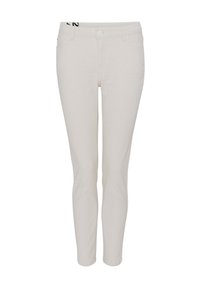 Light beige jeans with slim fit, front pockets, button closure, and black logo on the waistband. Smooth texture, minimal design.