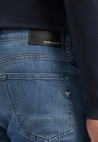 Pure Path Slim fit jeans - denim mid blue