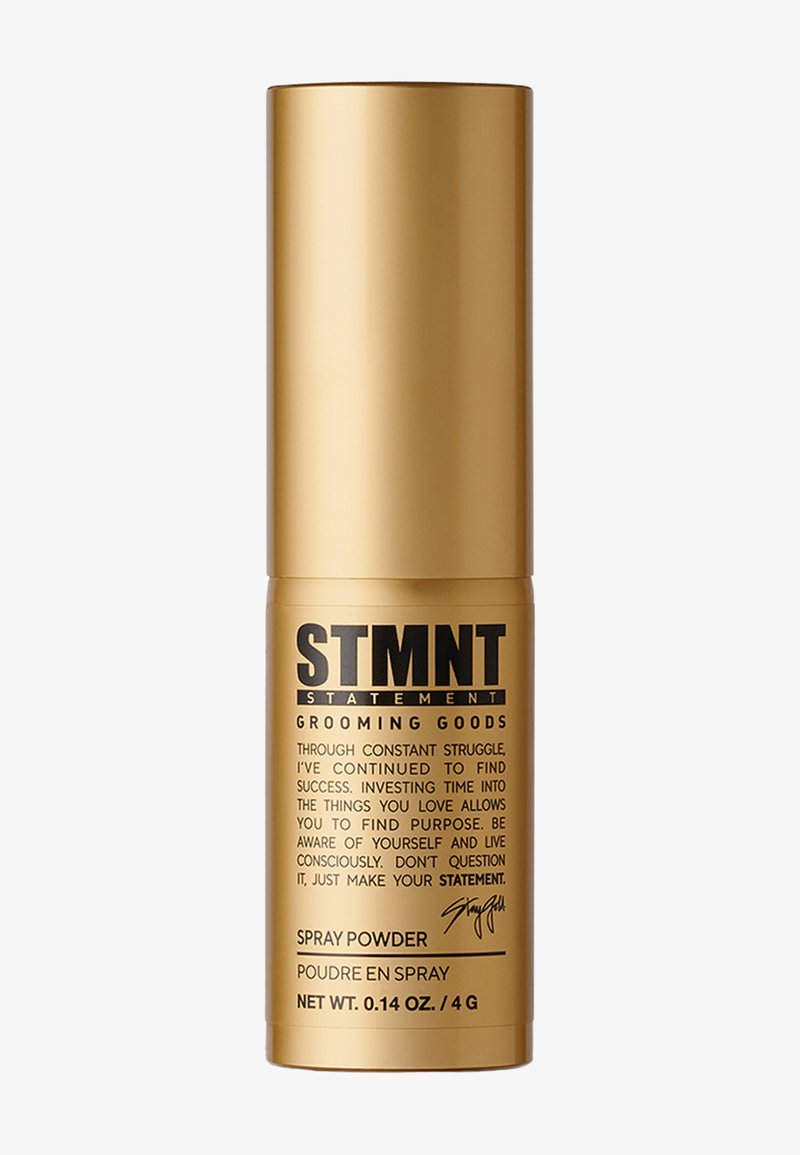 Guldfärgad cylindrisk spraybehållare med svart text och logotyp. Innehåller groomingspulver. Snygg design, matt yta, kompakt storlek. Nettovikt: 0,14 oz.