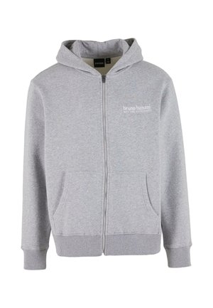 Gray zip-up hoodie made of soft fabric with large front pockets, ribbed cuffs, and a drawstring hood. Features a small logo on the chest.