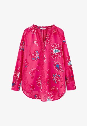 Blouse rose avec motif floral bleu et blanc. Tissu léger, patte de boutonnage et encolure froncée. Manches longues avec détails aux poignets.