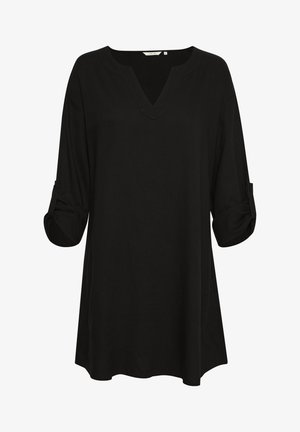 Musthave musta tunika pikkade varrukatega, mis on üles keeratud, V-kujulise kaelusega ja laia lõikega. Valmistatud kergest kangast, millel on sile tekstuur.