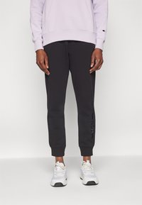 Champion ICONS CUFF PANTS LARGE LOGO - Tréningruha alsók - black