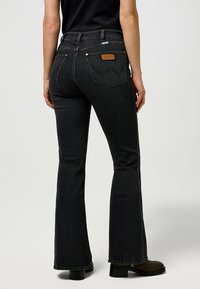 Wrangler MONTANA - Flared jeans - constellation