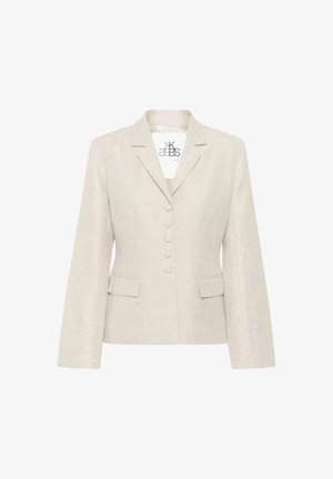 Bežs uzvalka žakets ar gludu tekstūru, ar iegrieztiem apkaklītes galiem, piecu pogu aizdari un diviem kabatas ar atloku. Pieguļoša siluets ar garām piedurknēm.