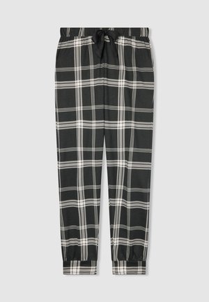 Pantaloni da pigiama a scacchi in bianco e nero con cintura elastica, fiocco in corda nera e polsini elastici su uno sfondo grigio chiaro.