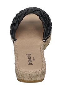 Black leather espadrille with braided strap, jute-wrapped sole, and beige insole, featuring stitched detailing along the edge.