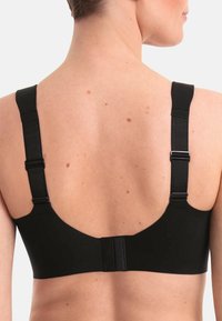 Reggiseno nero con spalline regolabili, materiale morbido e chiusura a gancio e asola. Texture liscia, design con schiena larga per supporto.
