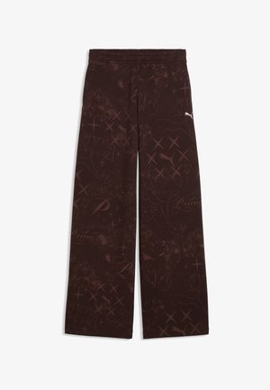 Mørkebrune bukser med vide ben, dekoreret med abstrakt mønster over det hele og lille hvidt Puma-logo på højre lår.