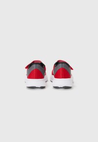 Red and gray athletic shoes with a breathable mesh upper, padded collar, and white sole featuring a textured grip pattern.
