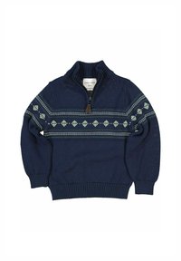 Tummansininen neulepusero, jossa on neljännesvetoketju, ja rintakehällä on vihreä ja valkoinen geometrinen kuvio. Valmistettu neulotuista materiaaleista.