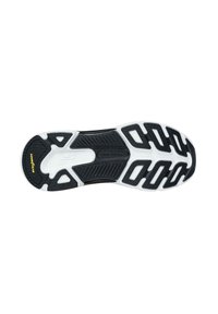 Suela de zapato deportivo en blanco y negro con un diseño de goma texturizada, canales prominentes y el logo "Goodyear" en amarillo.