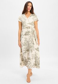 Blumiges Wickelkleid in Creme mit grünem botanischem Druck, kurzen Ärmeln, tailliertem Gürtel und einem fließenden, knöchellangen Rock.