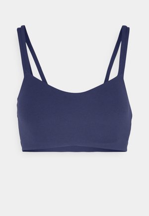 Bralette blu navy realizzato in tessuto liscio, con spalline sottili e regolabili e un design senza cuciture con scollatura arrotondata.
