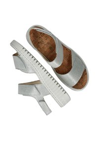Zilveren kurken platform sandalen met gestructureerde synthetische bandjes. Open achterkant ontwerp, met een witte rubberen zool met geribbelde details.