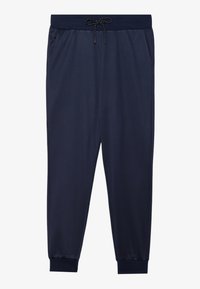 Marinblå mjukisbyxor gjorda av ett mjukt tyg, med ett elastiskt midjeband med dragsko, sidofickor och smala ärmslut.