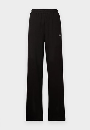 Schwarze, gerippte, weit geschnittene Hose mit elastischem Bund und kleinem dekorativem Logo, aus einem glatten Material mit langem Design.
