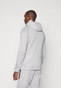 The North Face MOUNTAIN ATHLETICS HOODED 1/4  - Džemperis su gobtuvu - pale grey heather/meld grey