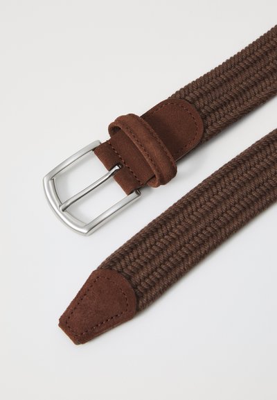 Brown woven fabric belt with a smooth leather loop and tip. Features a silver metal rectangular buckle and sturdy stitching details.