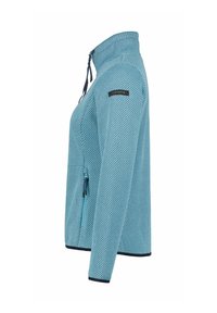 Veste zippée bleue en tissu texturé, avec un col haut et un motif diagonal. Elle dispose d'une poche zippée sur le côté et d'accents contrastants bleu marine.