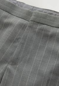 Gray dress pants in a subtle pinstripe pattern, with a smooth texture and tailored fit, featuring a straight hem and classic waistband.