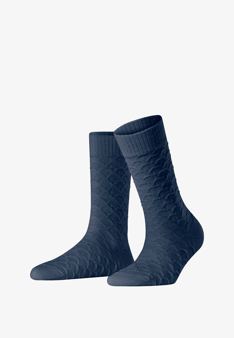 Navy blue socks with a textured diamond pattern, ribbed cuff, and reinforced toe, made from a soft, stretchy material for comfort.