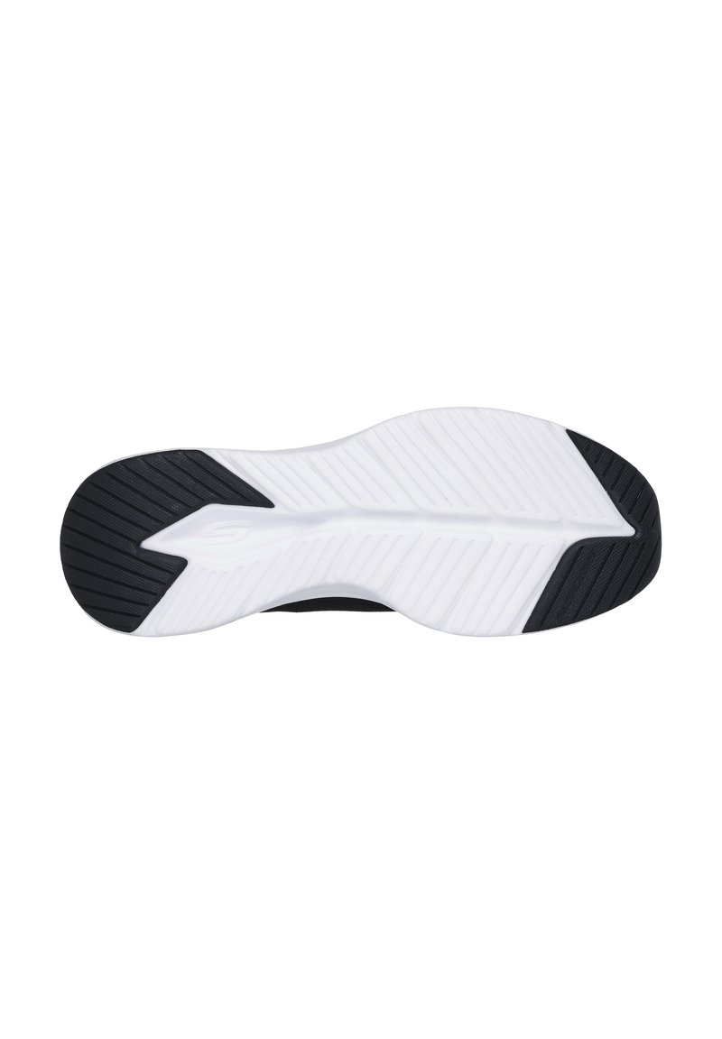Suela de zapatilla deportiva en blanco y negro con un patrón de agarre texturizado, un diseño curvado elegante y surcos de tracción pronunciados.