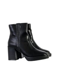 Bottines en cuir noir avec un panneau latéral texturé, un talon épais et un bout arrondi. Fini lisse et design minimaliste.