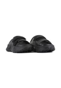 Black slide sandals with textured rubber soles, adjustable strap, and a contoured footbed for comfort. Suitable for casual wear.