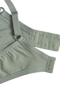 Bralette vert clair en tissu doux, avec des bretelles ajustables et une fermeture à crochets. Présente des détails de couture subtils et une texture lisse.