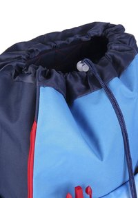 Drawstring backpack in blue and navy, features a gathered top, textured fabric, red zipper accents, and a closure toggle.