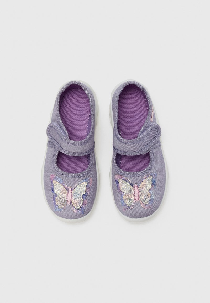 Purple fabric shoes with a stretchy strap, featuring a shiny butterfly design in pink and blue on the toe area and a textured inner lining.