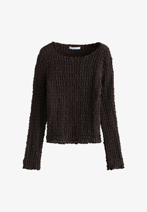 Brown long-sleeve sweater with a textured, ribbed fabric, featuring a wide boat neckline and a cropped cut with scalloped edges.