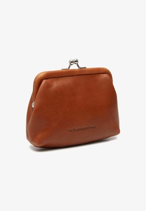 Brown leather coin purse with a rounded, soft shape, metal clasp closure, and embossed branding on the front. Smooth texture.