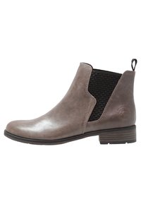 Bottine en cuir marron avec panneaux élastiques sur les côtés et une languette arrière, présentant un dessus lisse, un talon plat et des accents noirs texturés.