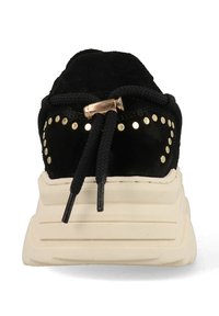 Black suede sneaker with a thick cream sole, featuring gold studs along the upper and black laces. Rounded toe and padded collar.