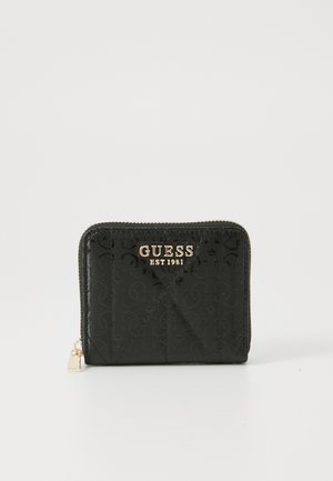 Black zip wallet made of textured synthetic material, featuring a patterned exterior and gold-tone hardware with "GUESS EST 1981" logo.